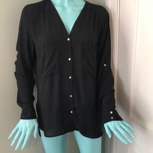 A cool flowy polka dot button down with high - low hem & mother of pearl bottons